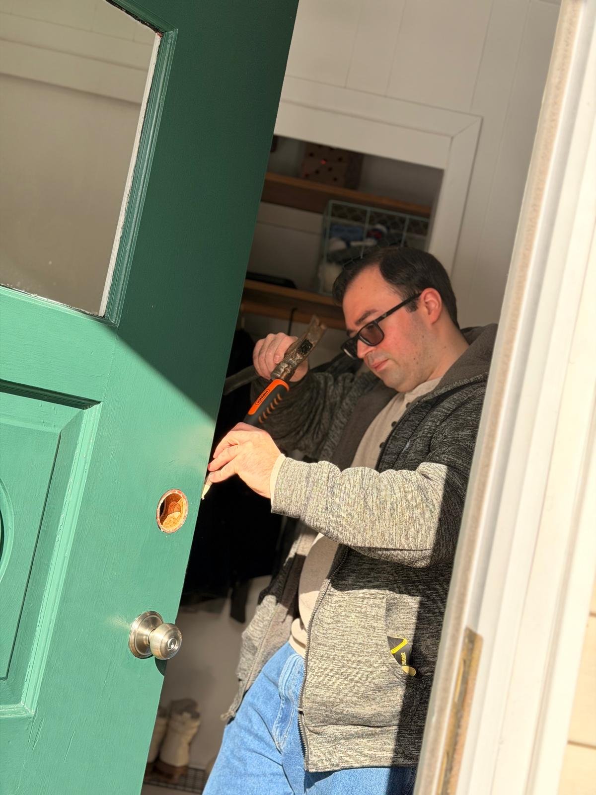 Technician installing commercial panic bar